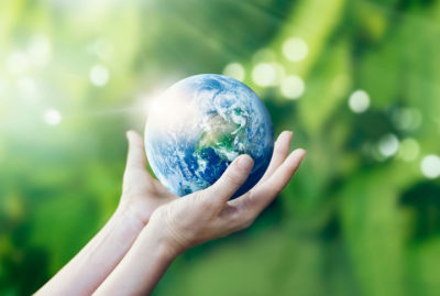 Hands holding and protect earth on nature background, Elements of this image furnished by NASA